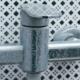 A chrome bathroom faucet showing heavy white mineral residue buildup and stains caused by hard water exposure over time.